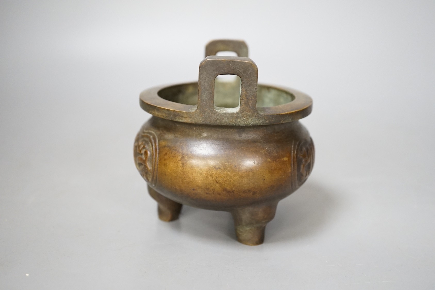 A Chinese bronze tripod Islamic market censer, Xuande mark - 13cm tall